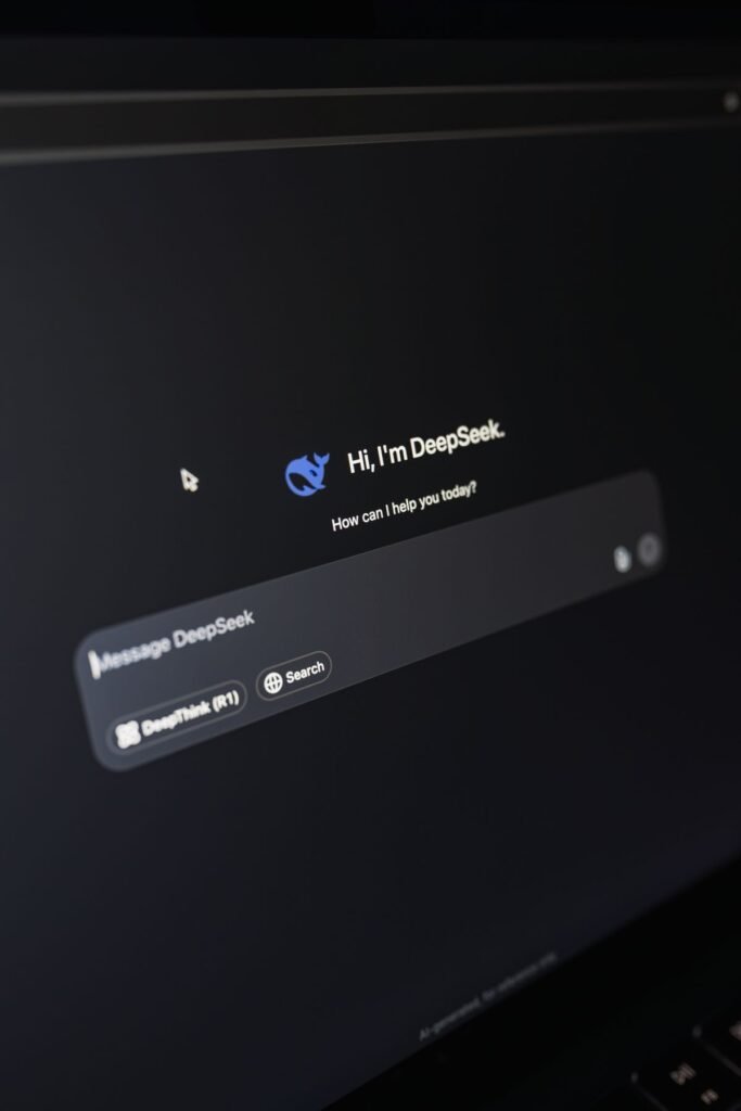 Use an AI writing assistant to draft an email on a laptop