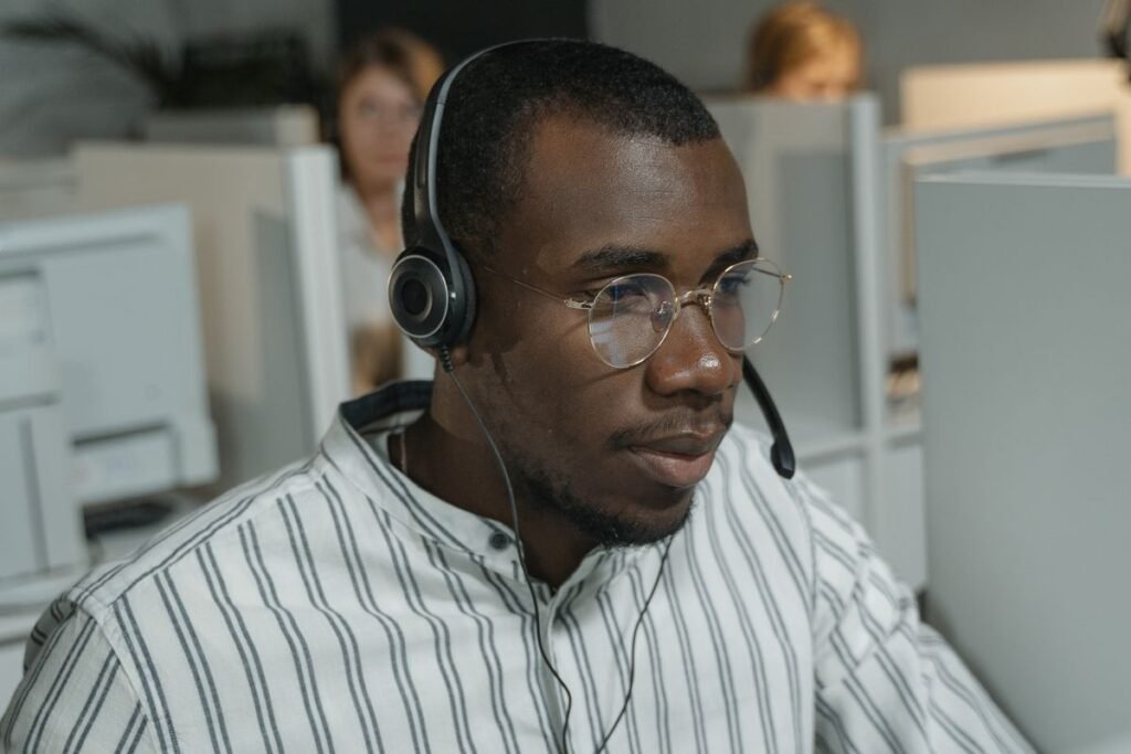 A person using Microsoft Outlook email on a laptop in a bright office